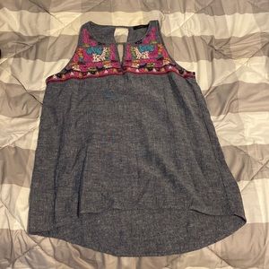 Grey tank top with beautiful design on the top